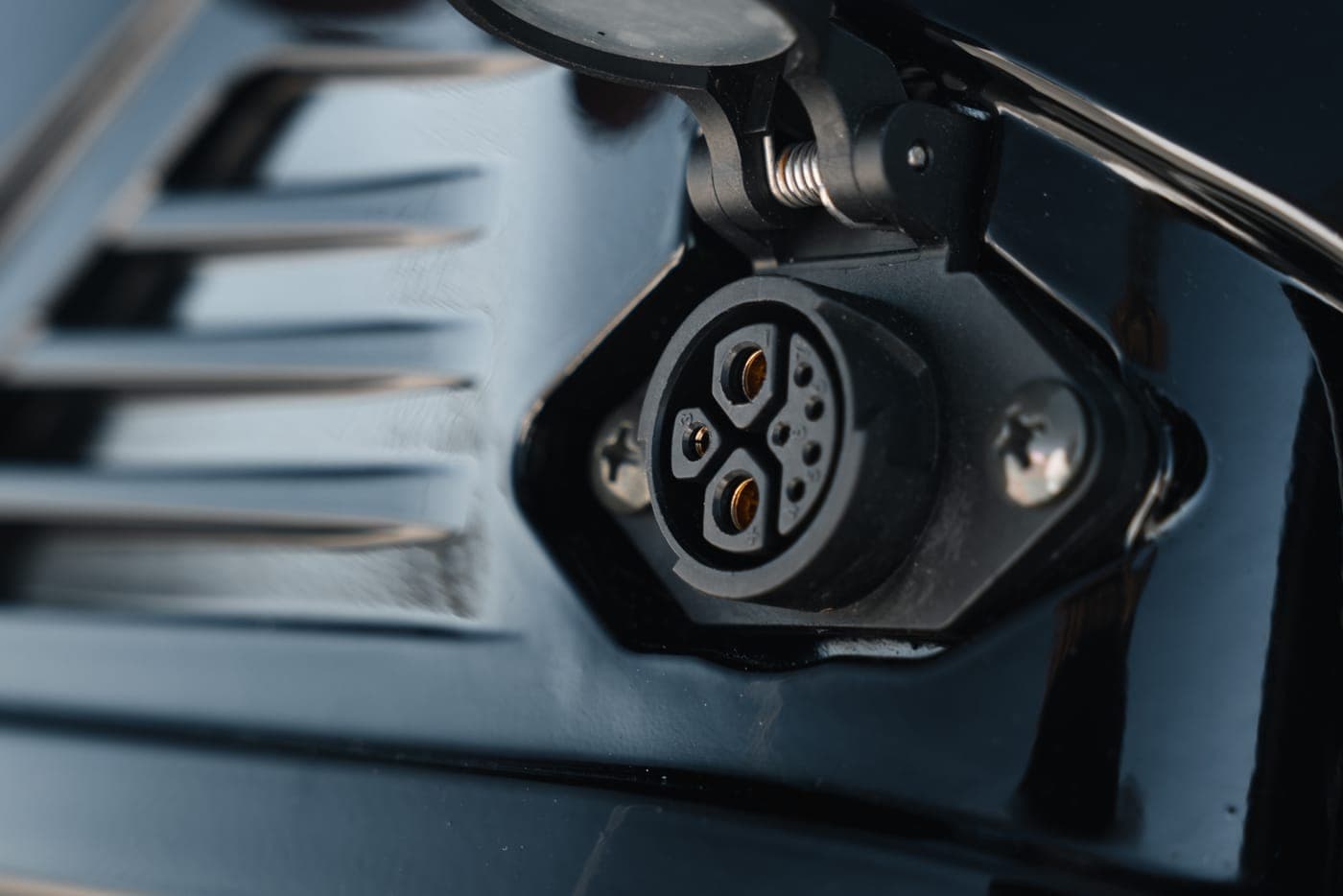 Charge port on the Revex MX battery housing