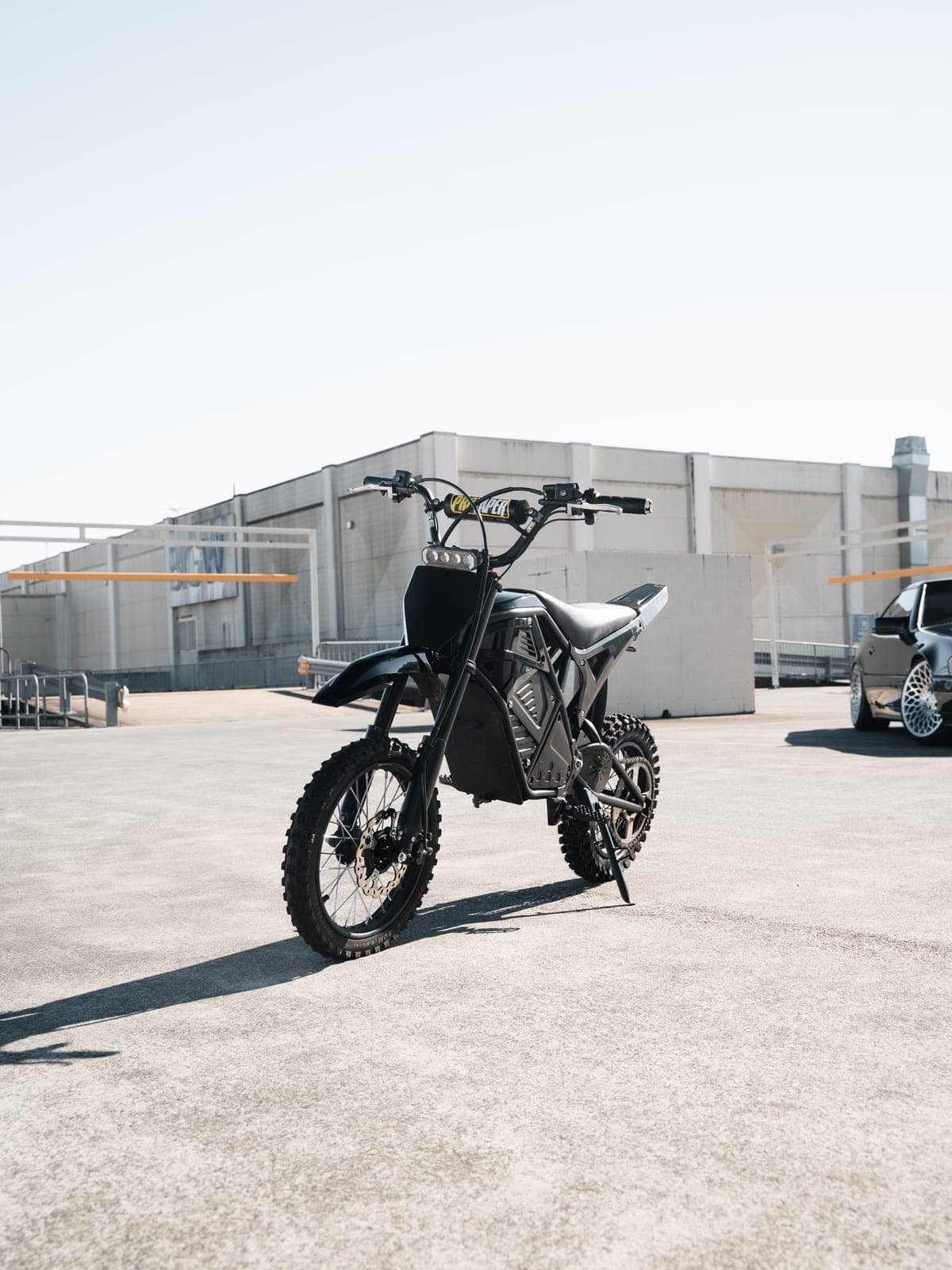 Revex MX electric dirt bike, front three-quarter view